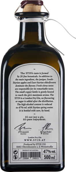 Braune Glasflasche mit weißem Etikett und Korkverschluss.