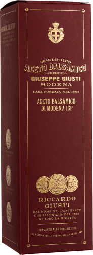 Bordeauxrote Verpackung mit goldener Schrift und Verzierungen, traditioneller Balsamico-Essig.