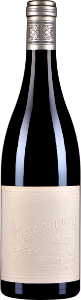 Flasche mit elegantem, dunkelblauem Glas, verziert mit einem silbernen, ornamental gestalteten Verschluss. Das Etikett ist schlicht und cremefarben, mit geprägten Schriftzügen.