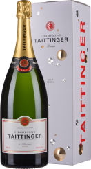 Eine große Champagnerflasche mit goldener Folie auf dem Korken, in einer eleganten Geschenkbox mit glänzenden Verzierungen.