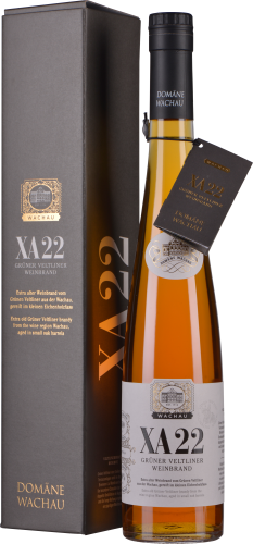 Schlanke, bernsteinfarbene Flasche mit schwarzem Verschluss neben eleganter Verpackung.