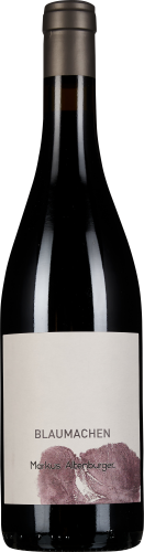 Dunkle Weinflasche mit mattem, gräulichem Verschluss und schlichtem, cremeweißem Etikett, das einen lilafarbenen, abstrakten Traubendruck zeigt.