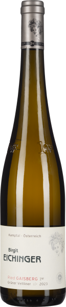 Die Weinflasche hat eine elegante, schlanke Form mit einem silberfarbenen Verschluss. Das Etikett ist überwiegend in Weiß gehalten und zeigt ein feines schwarzes Porträt. Die Flasche schimmert in einem klaren, goldenen Farbton, typisch für Weißwein.