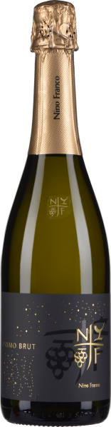 Flasche Schaumwein mit goldener, strukturierter Folie am Hals und elegantem, dunkel gestaltetem Etikett mit goldenen Verzierungen und Traubenmotiven.