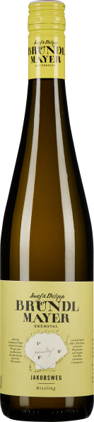 Langhalsige Weinflasche mit gelbem Etikett und Schraubverschluss, darauf eine stilisierte Karte und Schriftzüge. Die Flasche ist transparent und zeigt den hellen Inhalt.