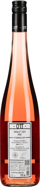 Roséweinflasche mit intensiv rosafarbener Flüssigkeit und schwarzem Schraubverschluss.