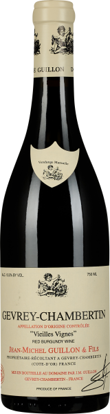 Flasche Rotwein mit elegantem, cremefarbenem Etikett und schwarzer Schrift. Der Hals ist mit einer dekorativen Kapsel verziert.