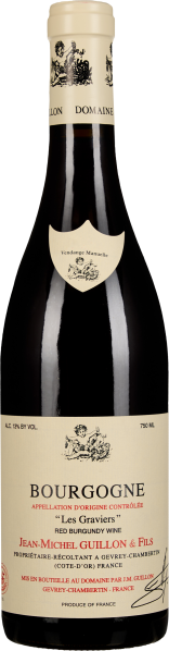 Eine dunkelgrüne Weinflasche mit cremefarbenem Etikett und rotem Schriftzug. Der Flaschenhals hat eine helle Kapsel mit dekorativen Elementen.