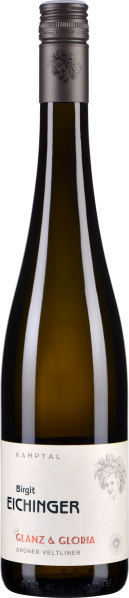 Eine schlanke Weinflasche mit dunkelgrünem Glas und silbernem Schraubverschluss. Das Etikett ist cremeweiß mit stilisiertem, monochromem Porträt und minimalistischer Gestaltung.