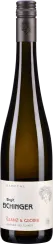 Eine schlanke Weinflasche mit dunkelgrünem Glas und silbernem Schraubverschluss. Das Etikett ist cremeweiß mit stilisiertem, monochromem Porträt und minimalistischer Gestaltung.