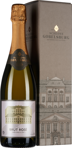 Flasche Rosé-Sekt mit goldfarbener Folie und Etikett, das ein historisches Gebäude zeigt, daneben eine elegante graue Schachtel mit identischem Design.