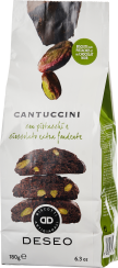 Die Verpackung zeigt braune Cantuccini mit sichtbaren grünen Pistazienstücken und dunkler Schokolade. Oben befinden sich zwei abgebildete Pistazien. Die Farbpalette ist hauptsächlich weiß mit grünen und braunen Details, was eine ansprechende, natürliche O