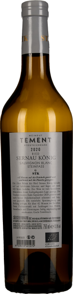 Eine schlanke Flasche mit goldgelber Flüssigkeit und silbernem Verschluss.