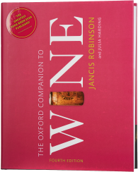 Ein Buch mit einem roten Cover, auf dem ein großer, weißer Titel "Wine" hervorsticht. Eine sichtbare Weinkorken-Grafik ist in die Mitte integriert. Der Hintergrund ist einfarbig und dekorativ gestaltet.