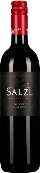 Dunkle Weinflasche mit rotem Schraubverschluss und elegantem, schwarzem Etikett; schlichte, moderne Gestaltung mit silberner und roter Schrift.