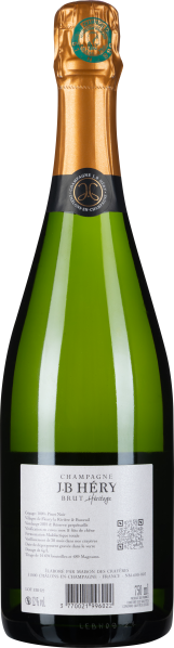 Grüne Champagnerflasche mit goldenem Verschluss und elegantem Etikett.
