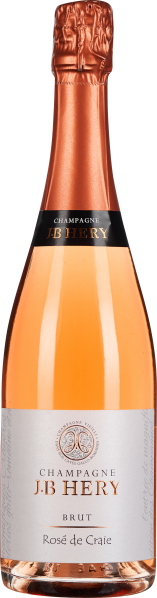 Eine Flasche Rosé-Champagner mit kupferfarbenem Hals und Etikett, klarer Glasflasche, gefüllt mit roséfarbenem Getränk.