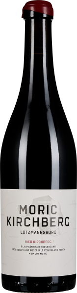 Eine elegante Weinflasche mit schwarzer Glasoberfläche und einer edlen roten Kapsel. Das Etikett ist schlicht gehalten, in Weiß, mit deutlicher schwarzer Schrift.