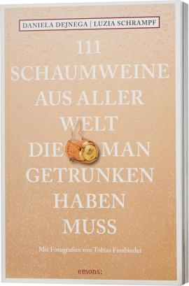 Buchcover mit beigem Hintergrund und weißen, erhabenen Schriftzügen, die eine Liste von Schaumweinen ankündigen. Zentral befindet sich ein Korken mit Agraffe als dekoratives Element.