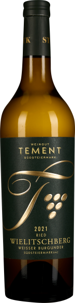 Weißweinflasche mit elegantem, dunkelgrünem Etikett und goldenen Akzenten; runde Form und schlanker, schwarzer Hals.