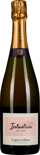 Champagnerflasche mit goldenem Folienverschluss, dunkelblauem Halsband und elegantem Etikett, das einen rosa Farbverlauf zeigt.