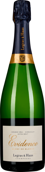 Grüne Champagnerflasche mit dunkelblauem Hals und goldener Verzierung, elegante weiße Etiketten mit goldener Schrift.