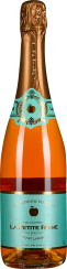 Die Flasche hat ein elegantes Design mit einem goldfarbenen, geprägten Verschluss. Das Etikett ist türkis mit goldenen Akzenten und einem apfelförmigen Emblem. Die Flüssigkeit hat eine warme, bernsteinartige Farbe.