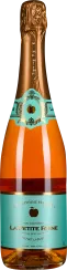 Die Flasche hat ein elegantes Design mit einem goldfarbenen, geprägten Verschluss. Das Etikett ist türkis mit goldenen Akzenten und einem apfelförmigen Emblem. Die Flüssigkeit hat eine warme, bernsteinartige Farbe.