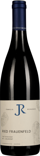 Flasche mit dunkelblauem Verschluss und cremefarbenem Etikett mit minimalistischer Gestaltung, vor schwarzem Hintergrund.