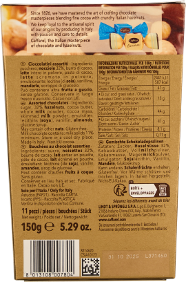 Verpackung mit gold-braunem Design und blauer Praline-Illustration.