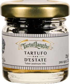 Kleines Glas mit goldfarbenem Deckel, etikettiert mit schwarz-weißer Schrift, enthält schwarze Trüffel.