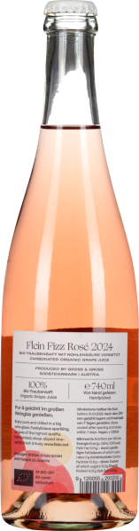 Rosa Getränk in einer klaren Flasche mit silbernem Verschluss und Etikett auf der Rückseite.