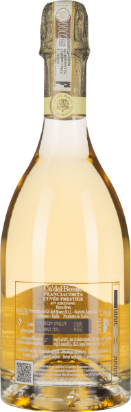 Goldener Schaumwein in eleganter, transparent gebogener Flasche mit festlichem Etikett.
