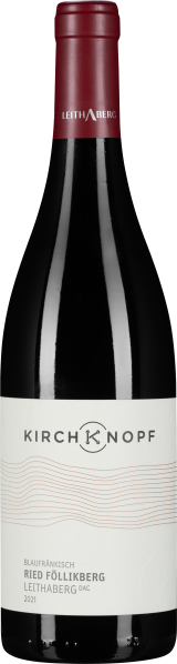 Dunkle Weinflasche mit rotem Kapselverschluss und modernem, minimalistischem Etikett in Weiß mit schwarzem und kupferfarbenem Text.