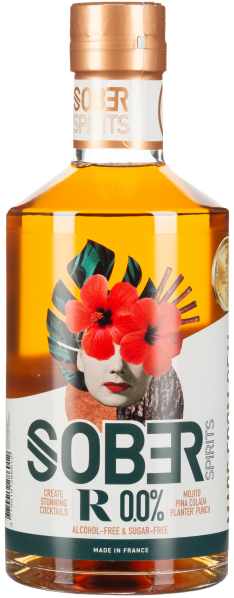 Klarglasflasche mit Kupferverschluss, floralem Etikett und Gesichtsgrafik in Rot und Grün.