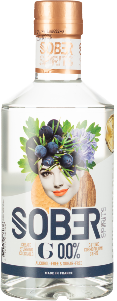 Klarflasche mit kunstvollem Gesichtsmotiv, kupferner Verschluss, grünes Laub und Früchte.