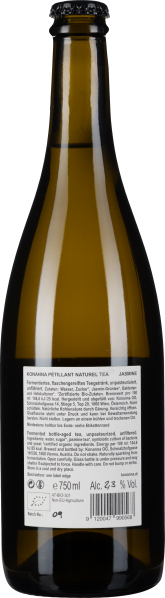 Braune Glasflasche mit schwarzem Verschluss und weißem Etikett hinten.