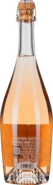 Transparente Flasche mit roséfarbenem Wein und Korkverschluss.