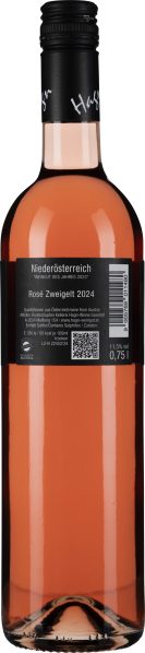 Klare Roséweinflasche mit schwarzem Etikett und schwarzem Schraubverschluss.
