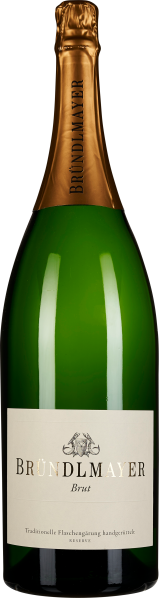 Grüne Sektflasche mit goldener Folie am Flaschenhals und einem eleganten, weißen Etikett.