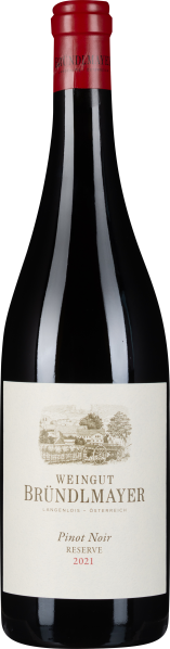 Dunkle Weinflasche mit rotem Schraubverschluss und eleganter, cremefarbener Etikettengestaltung.