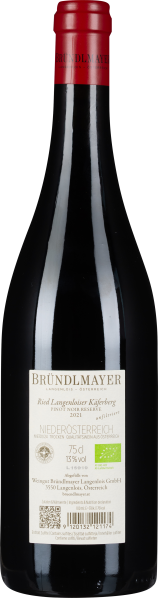 Dunkle Weinflasche mit rotem Verschluss, elegantes Etikett in Weiß und Gold.