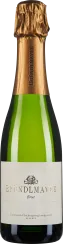 Die Flasche zeigt einen eleganten Sekt mit grüner Glasflasche und goldener Kapsel. Das Etikett ist schlicht und hell gehalten, mit einem stilisierten Logo in Schwarz und goldener Schrift.