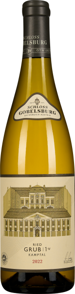 Weinflasche mit gelbem Inhalt, elegantem Etikett und Abbildung eines klassischen Gebäudes.