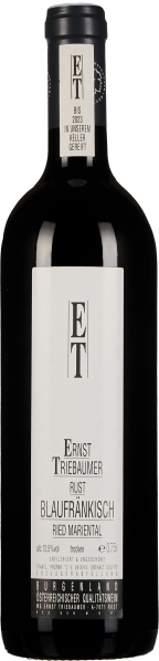 Dunkle Weinflasche mit schlichtem, weißem Etikett, das vertikal bedruckt ist, und schwarzem Verschluss.