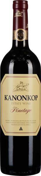 Eine Weinflasche aus dunklem Glas mit einer weinroten Kapsel. Das Etikett ist cremefarben mit einem eleganten, minimalen Design, worauf goldene Verzierungen und schwarze Schrift zu sehen sind. Das Gesamtbild vermittelt einen klassischen, hochwertigen Eind