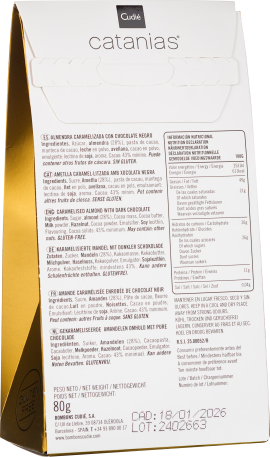 Weiße Verpackung mit goldener Seite, schwarzem Logo und mehrsprachigem Text.