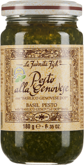 Glas mit grünem Pesto, goldgelbes Etikett mit floralem Rand und braunem Schriftzug.