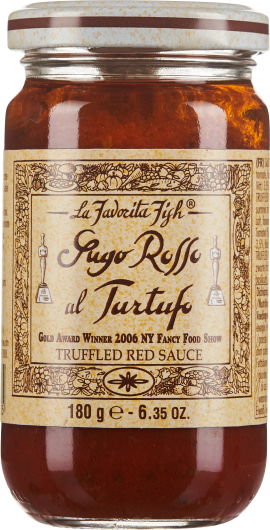 Ein Glas mit roter Trüffel-Sauce, das ein elegantes Etikett mit dekorativen, goldfarbenen Mustern und schwarzer Schrift trägt. Der Deckel ist weiß mit einem braunen Streifen.