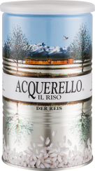 Metallene Reisdose mit Landschaftsmotiv: schneebedeckte Berge, Gebäude und Bäume. Unten sind Reiskörner abgebildet.